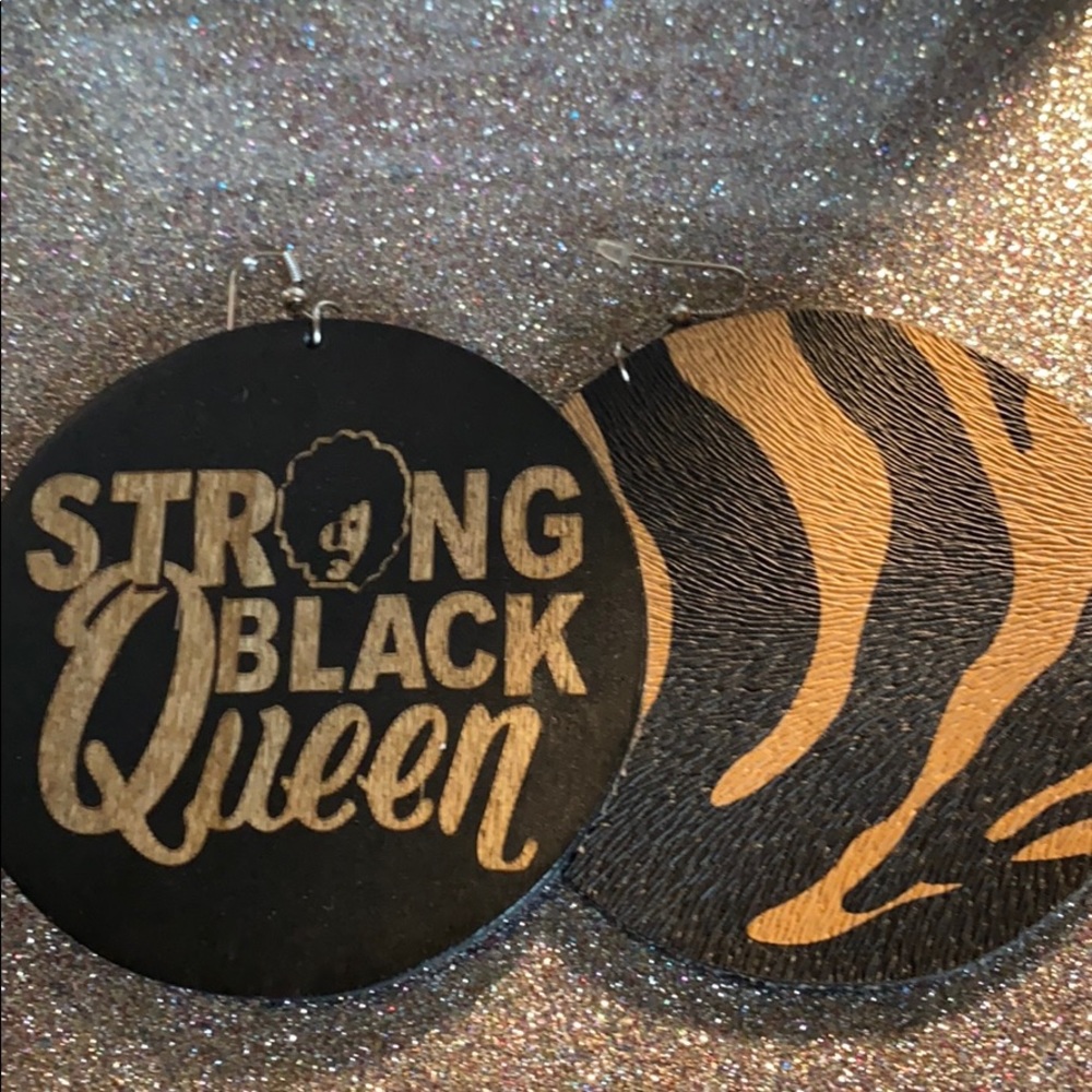 Hand made wood earrings/animal print on the back.